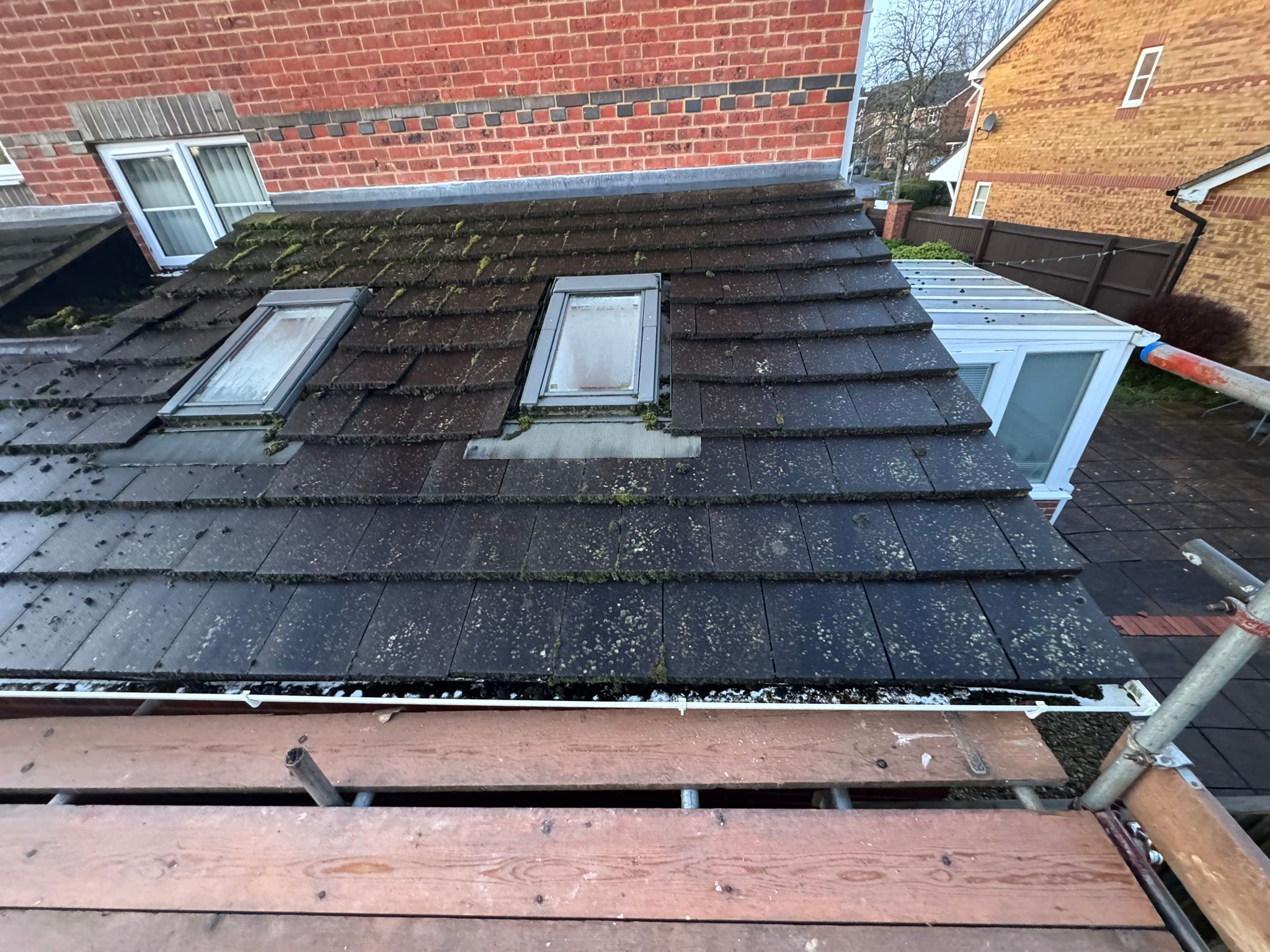 Roof before — moss covered tiles