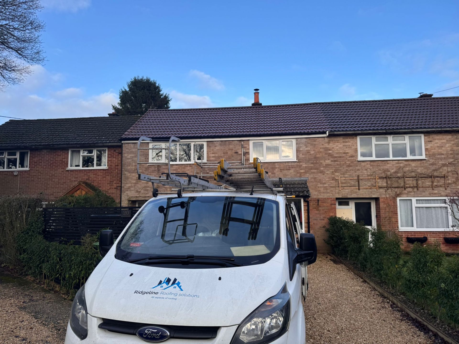 Ridgeline Roofing van on site